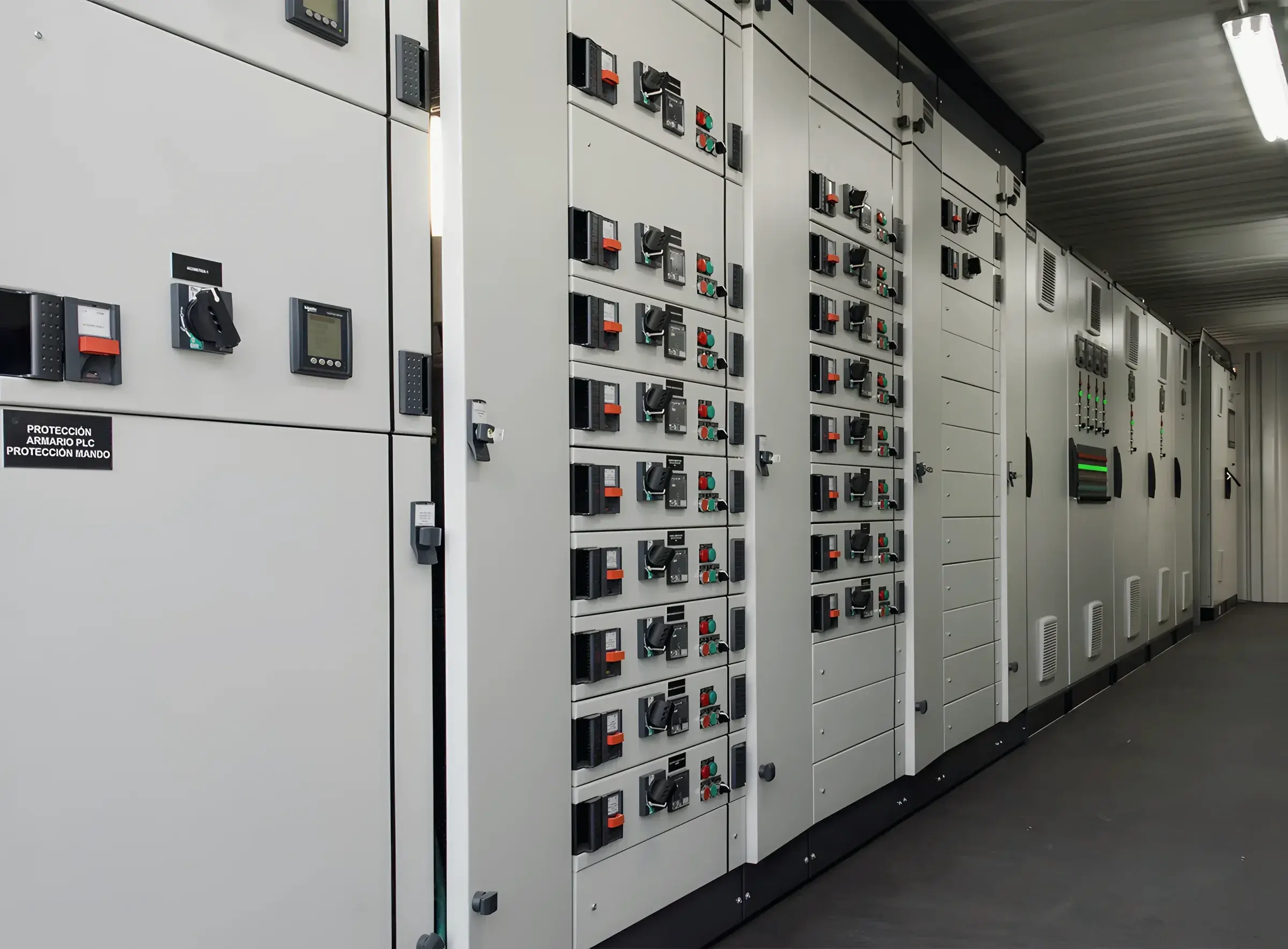 Rows of low-voltage circuit breakers on a switchboard front