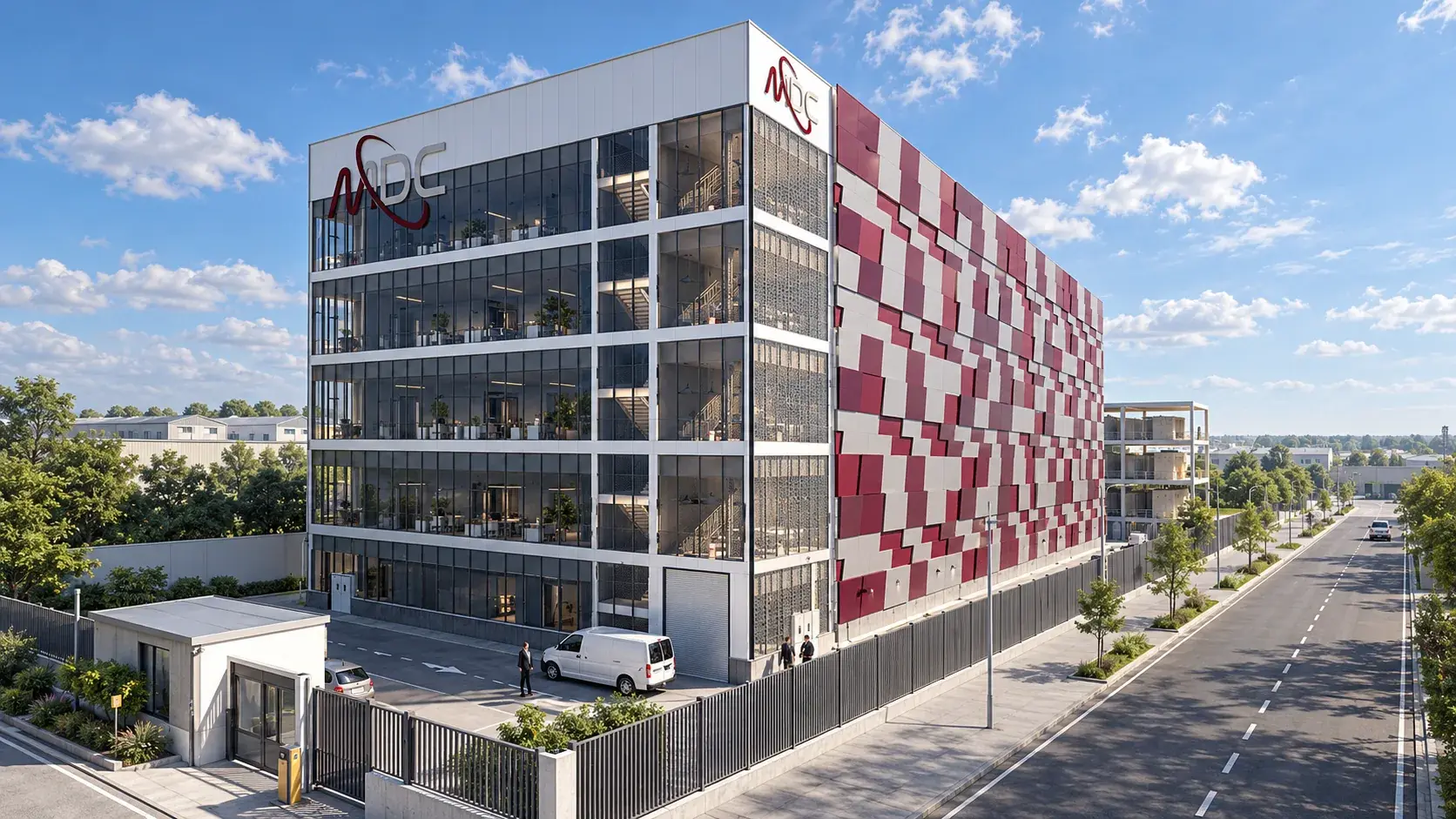 Concept visualisation of the repeatable facility module: a multi-storey block with a glazed front elevation under white slab bands and a long side elevation of burgundy, grey and white panels, a gatehouse and fence at the street